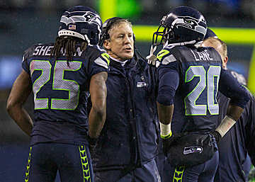 The technique taught by Carroll and his staff has allowed Seattle to maintain one of the league's most physical defenses. (Stephen Brashear/Getty Images)